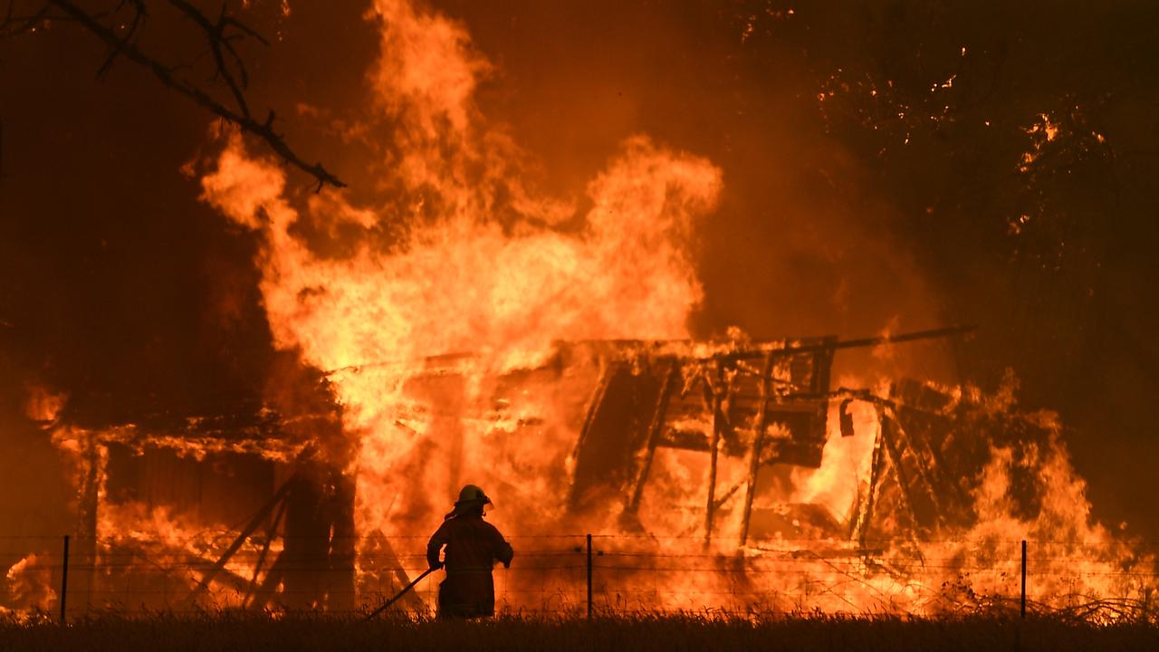 NSW Rural Fire Service crews fight the Gospers Mountain Fire at Bilpin on December 21. Picture: Dan Himbrechts/AAP