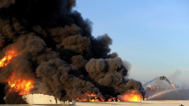 Firefighters tackling the massive blaze yesterday. Picture: Andrew Henshaw