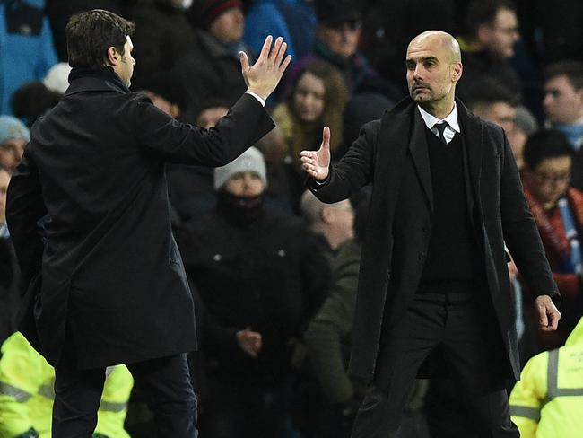 Mauricio Pochettino (L) shakes hands with Pep Guardiola last season.