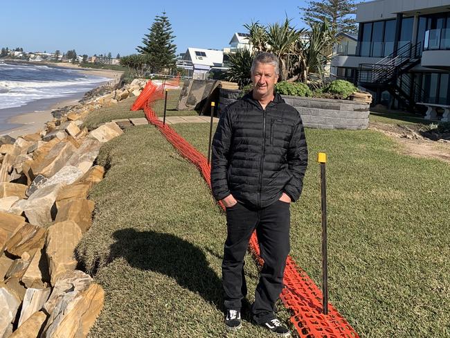 North The Entrance beachside resident Paul Green installed 350 tonnes of rock in front of his apartment block one month ago. Picture: Ben Pike