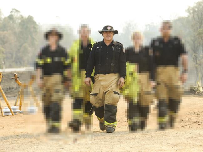 NEWS - Shane Macklin among other locals who stood shoulder-to-shoulder to fight the ferocious firestorm that threatened to wipe a town - Gracemere - off the map. Pic Mark Cranitch.