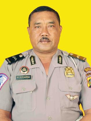 Bali police officer Wayan Sudarsa was allegedly bashed by David Taylor with a beer bottle, police say.
