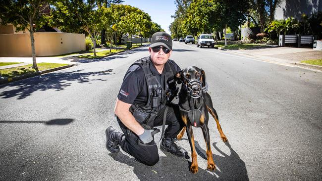 Back on patrol: Security guard Wayne Heneker and his dog Boss keep an eye out for trouble on Gold Coast streets. Picture: Nigel Hallett