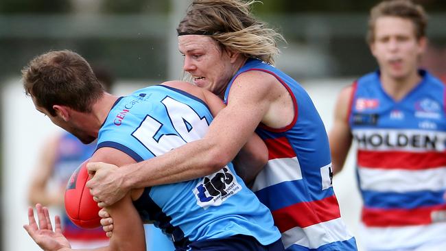 Former Carlton player Nick Holman (right) will bring this kind of pressure to the Suns this year. Picture: Calum Robertson