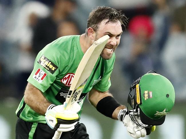 MELBOURNE, AUSTRALIA - DECEMBER 15:  Glenn Maxwell of the Melbourne Stars raises his bat after scoring 100 runs during the Men's Big Bash League match between the Melbourne Stars and the Sydney Sixers at Melbourne Cricket Ground, on December 15, 2021, in Melbourne, Australia. (Photo by Darrian Traynor/Getty Images)