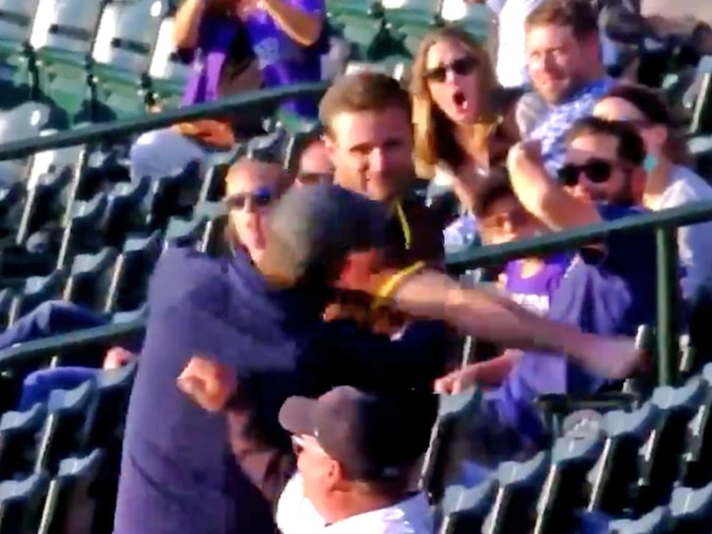 The younger Padres fan absolutely nailed the Rockies fan.