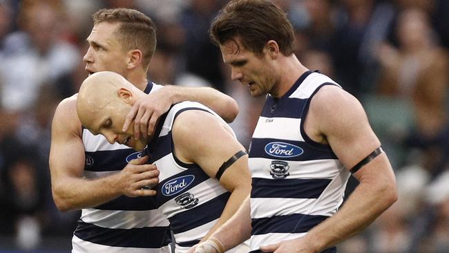 Gary Ablett of the Cats (centre) celebrates a goal with Joel Selwood (left) and Patrick Dangerfield during the Round 5 AFL match between the Hawthorn Hawks and the Geelong Cats at the MCG in Melbourne, Monday, April 22, 2019. (AAP Image/Daniel Pockett) NO ARCHIVING, EDITORIAL USE ONLY