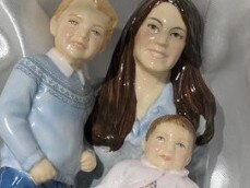 This figurine of the Duchess of Cambridge, Prince George and Princess Charlotte has caused a stir. Picture: Twitter/@amelia_perrin