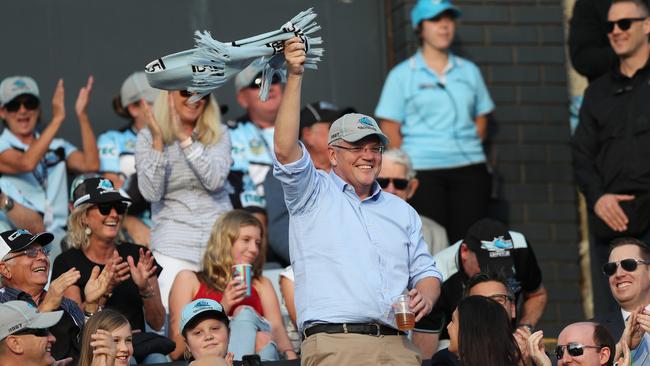 Mr Morrison waves to the crowd on arrival to the Cronulla v Manly match today. Picture: Brett Costello