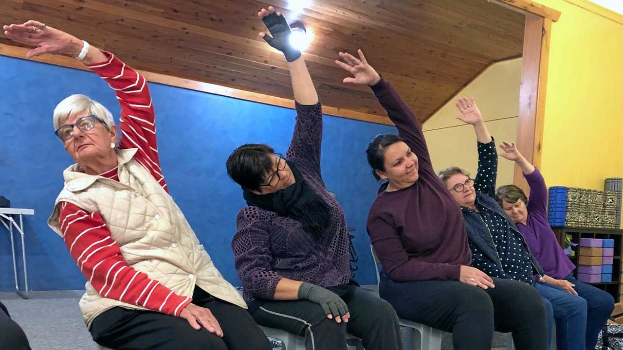 CLASS IN SESSION: Megan Brown (centre) leads her popular seated yoga class for Roma U3A. Picture: Jorja McDonnell