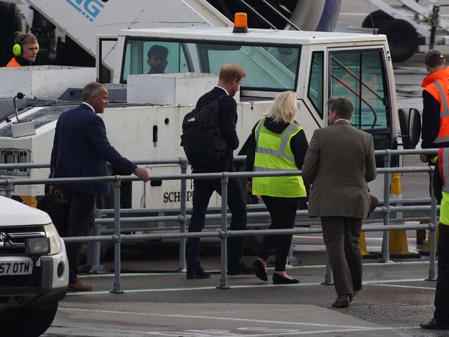 Prince Harry boards a flight at Aberdeen Airport. Picture: Getty Images.