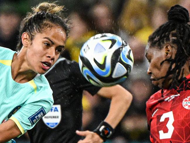 Australia's midfielder #19 Katrina Gorry (L) and Canada's defender #03 Kadeisha Buchanan fight for the ball during the Australia and New Zealand 2023 Women's World Cup Group B football match between Canada and Australia at Melbourne Rectangular Stadium, also known as AAMI Park, in Melbourne on July 31, 2023. (Photo by WILLIAM WEST / AFP)