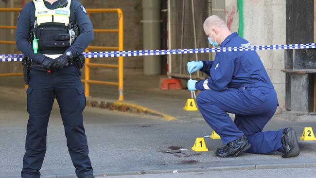 Police inspect the scene where Jonathan Dick was arrested. Picture: David Crosling/AAP