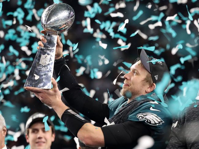 MINNEAPOLIS, MN - FEBRUARY 04: Nick Foles #9 of the Philadelphia Eagles celebrates with the Vince Lombardi Trophy after his teams 41-33 win over the New England Patriots in Super Bowl LII at U.S. Bank Stadium on February 4, 2018 in Minneapolis, Minnesota. The Philadelphia Eagles defeated the New England Patriots 41-33.   Rob Carr/Getty Images/AFP == FOR NEWSPAPERS, INTERNET, TELCOS & TELEVISION USE ONLY ==