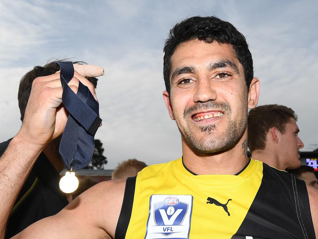 Marlion Pickett with his medal for best on ground during the VFL Grand Final.