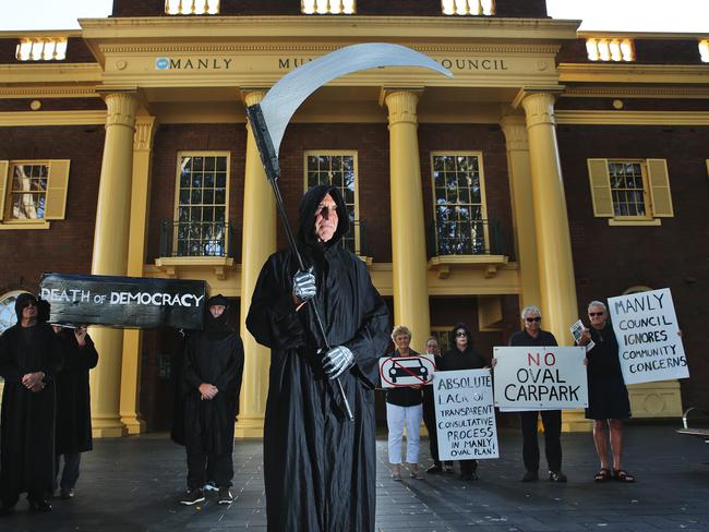 The Save Manly Oval Alliance protested outside Manly Council Chambers in black with the Grim Reaper, pallbearers outfits and an special coffin after ‘the death of democracy’ on April 12. Picture: Braden Fastier