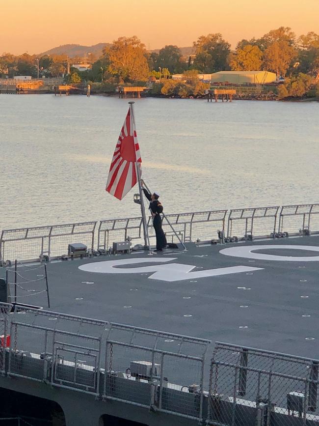 The Japanese national anthem and the Australian national anthem were played after the flag was lowered on the JS Kunisaki after its arrival in Brisbane this week. Picture: Peta Berry