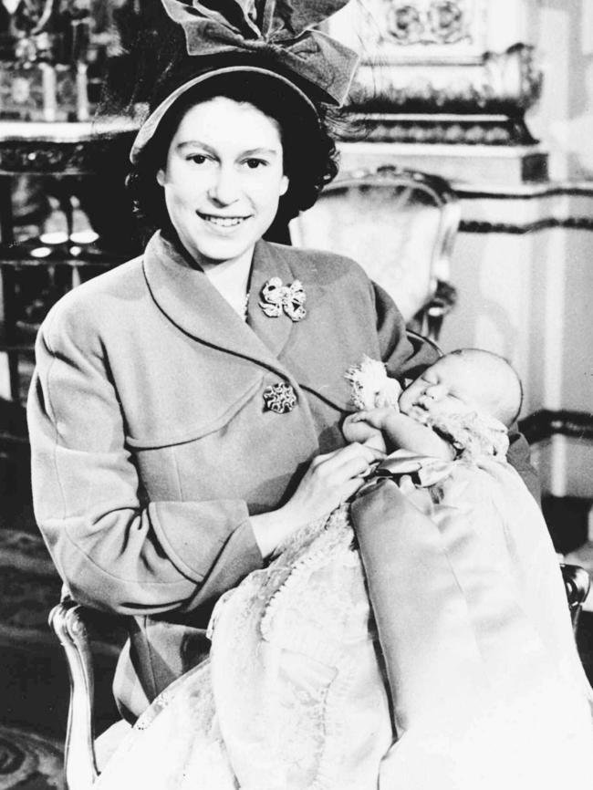 Princess Elizabeth with Prince Charles at his christening on 15 Dec 1948.