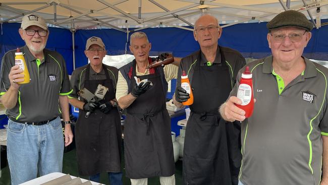 Men's Shed Labrador members Graham Firth, Tony Beck, Peter Kendall, Merv Holliday and Len Thomson cooking democracy sausages. Picture: Kathleen Skene