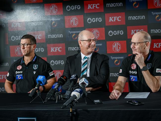 ADELAIDE, AUSTRALIA - FEBRUARY 12:Josh Carr senior assistant coach of Port Adelaide  ,Port Adelaide Football Club chairman David Koch and Ken Hinkley senior coach of Port Adelaide  speak to the media during a Port Adelaide Power AFL press conference at Alberton Oval on February 12, 2025 in Adelaide, Australia. (Photo by Mark Brake/Getty Images)