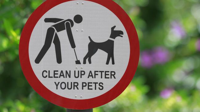 "Clean up after your pets" sign at the park. Picture: iStock