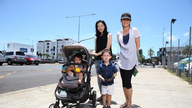 Atsuko Homma on Aplin St with her children Chloe Boyd, 1, and Ryan Boyd, 3 and her friend Yuko Ono. Picture: Brendan Radke