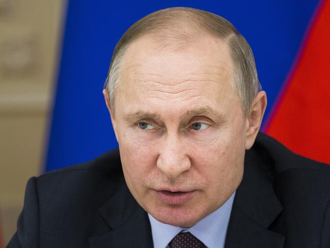 In this photo taken on Tuesday, March 6, 2018, Russian President Vladimir Putin during his trip to Yekateringburg, Russia . After hopping by helicopter back to Yekaterinburg, Russia's fourth-largest city which is a key industrial hub, Putin chaired a meeting with top officials on training industrial personnel. President Vladimir Putin has sought to reach out to voters across Russia. Putin has appealed to various social groups and traveled to many of the countryâ€™s far-flung regions, promising to bolster the economy, raise living standards and combat poverty. (AP Photo/Alexander Zemlianichenko)