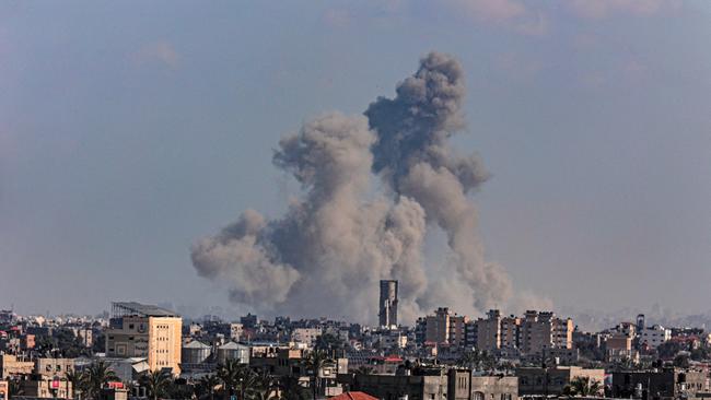 A picture taken from Rafah shows smoke billowing over Khan Younis on Tuesday. Picture: AFP