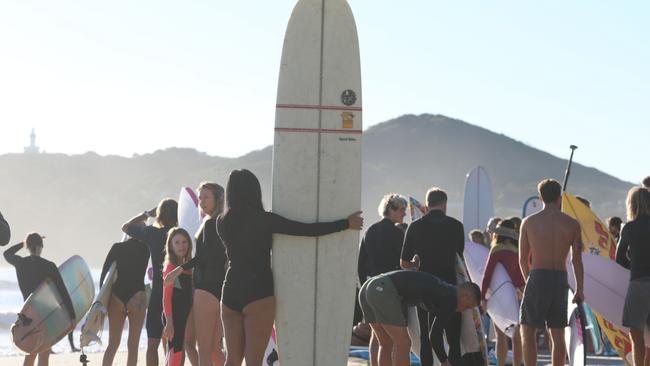 Participants in a paddle-out protest in Byron Bay to oppose the Netflix reality show, Byron Baes. Picture: Liana Boss