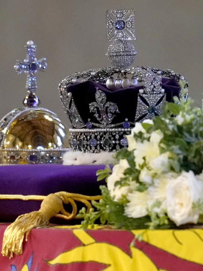 The Queen’s coffin draped in the Royal Standard with the Imperial State Crown and the Sovereign's orb and sceptre. Picture: Kirsty Wigglesworth/Getty Images