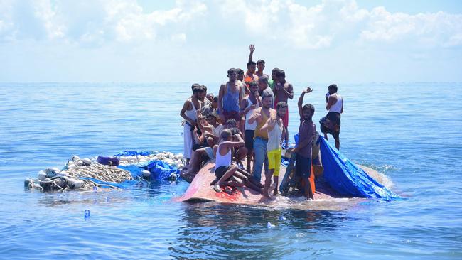 Rohingya refugees await rescue by BASARNAS 16 nautical miles off Aceh, after weeks at sea. 69 were saved following a capsize. Picture: Zahlul Akbar/AFP