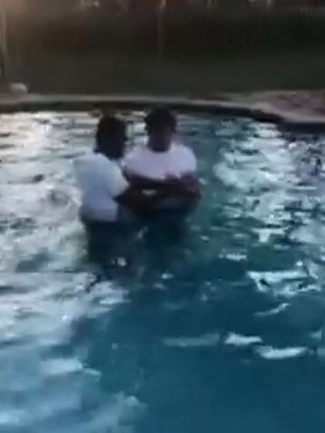 Roets being baptised in the Folau backyard pool.