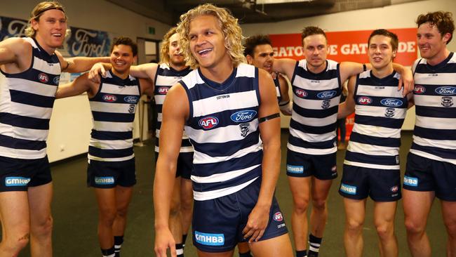 Quinton Narkle in the middle of the circle after Geelong defeated Sydney.