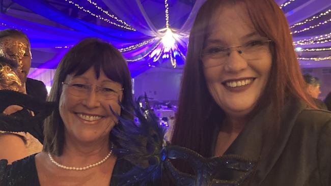 Daph Backhouse and Donnah Hartwig celebrate at the Gympie RSL Masked Ball, April 29 2023.