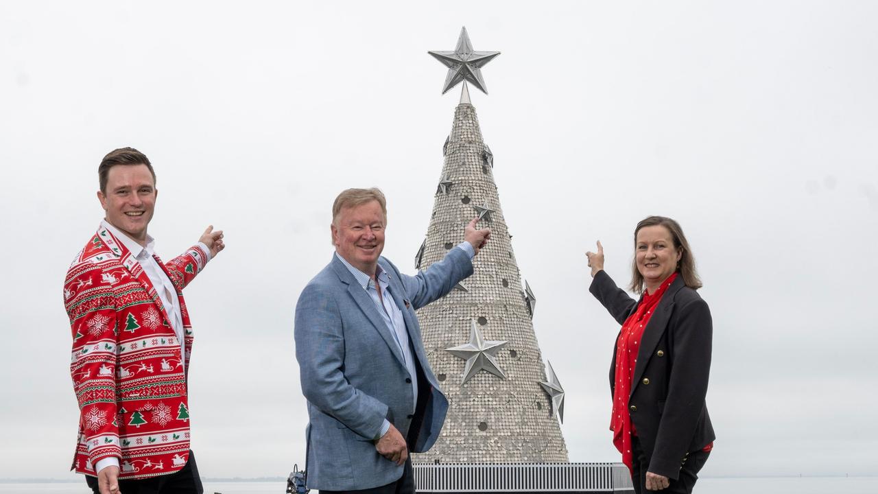 Denis Walter (centre) and Geelong councillors Trent Sullivan and Melissa Cadwell welcome the arrival of the Floating Christmas tree earlier this week.