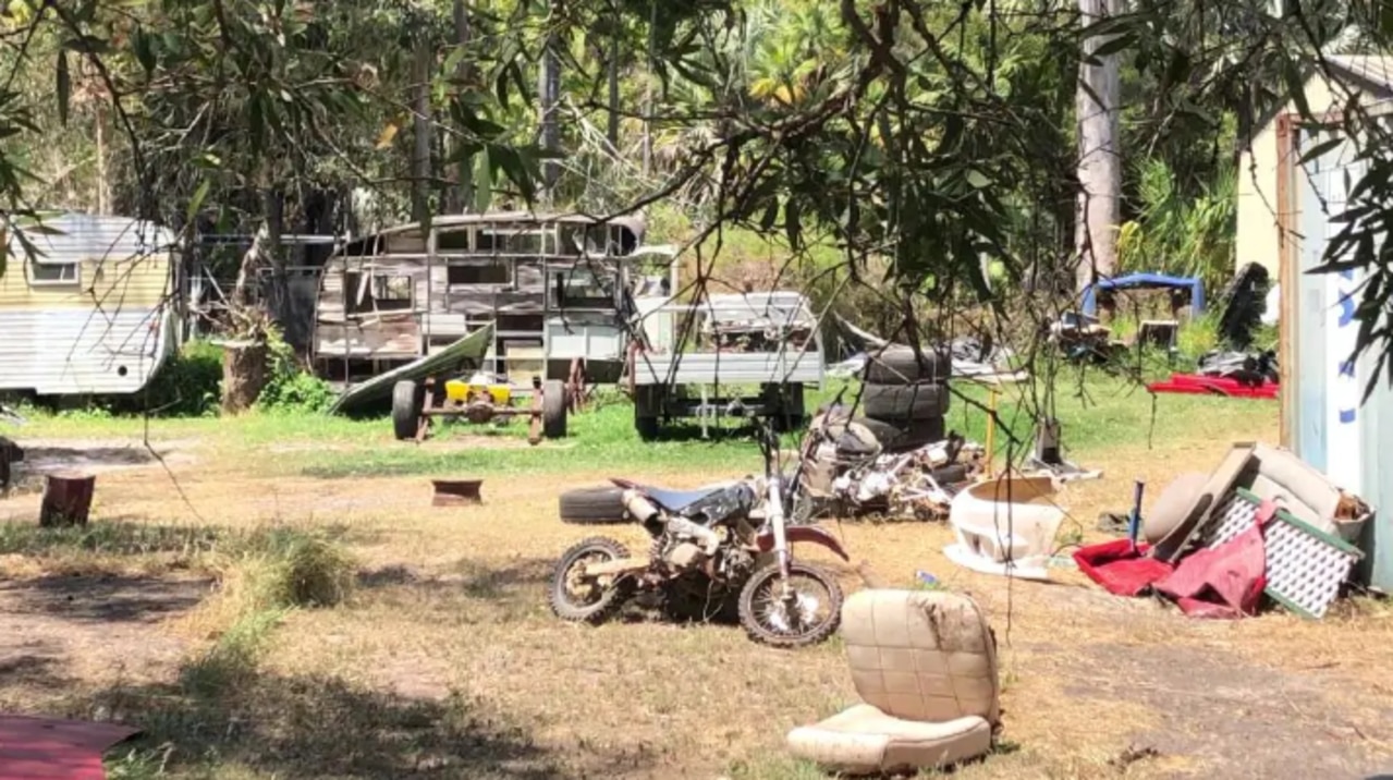 Cars and car parts at the property.