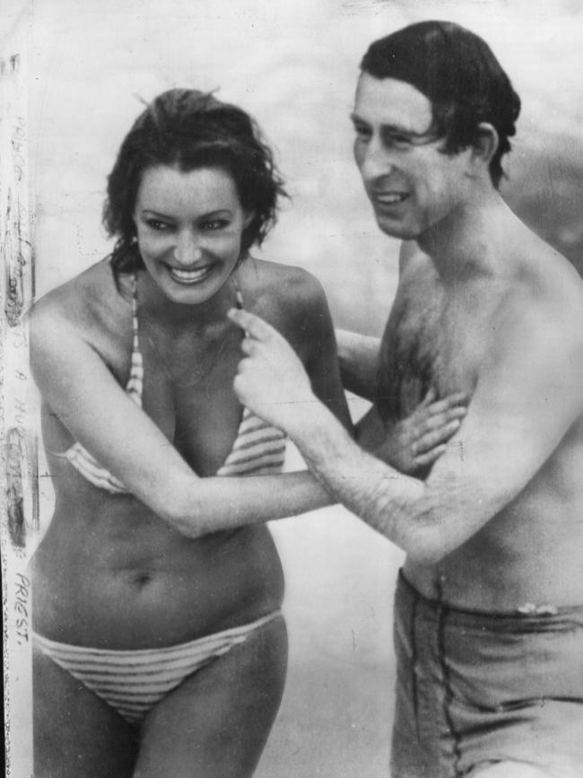 Model Jane Priest famously kisses a young Charles on Cottesloe Beach in Perth in 1979.