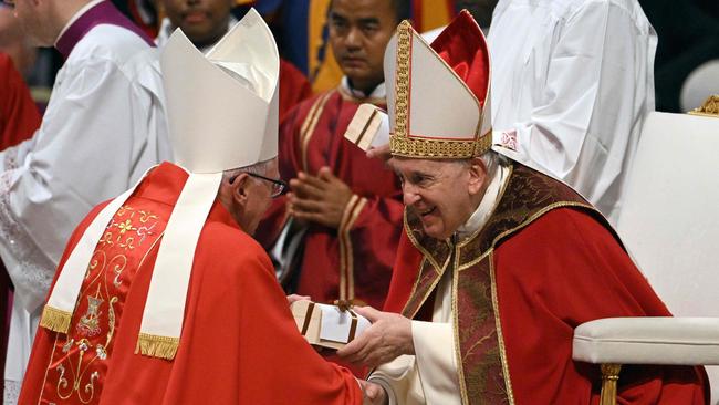 Pope Francis hands over a pallium to a newly appointed metropolitan archbishop during a mass for the Solemnity of Saints Peter and Paul on June 29 at the Vatican.