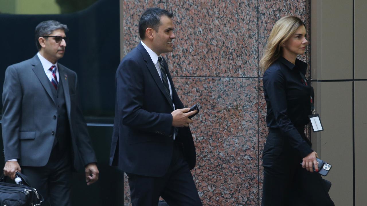 Magnis (US) managing director Hoshi Daruwalla (left) and Chair Frank Poullas and an unidentified woman arrive for their AGM. John Feder/The Australian