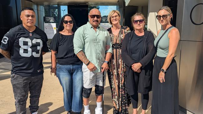 Westfield Helensvale security guard Johnny Whenuaroa (centre, with the cane), alongside friends and family members outside Southport Courthouse on May 27, 2025. Picture: Alex Treacy
