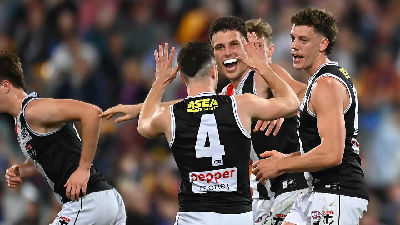 St Kilda players celebrate a Jack Hayes goal on his return from injury. Picture: Albert Perez/AFL Photos via Getty Images.