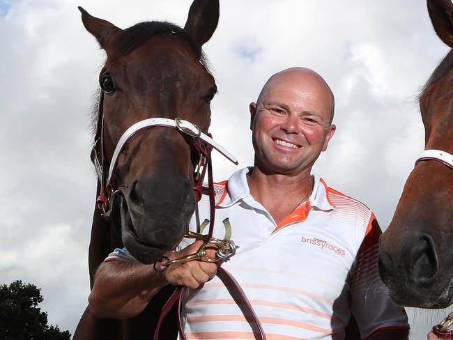 Murwillumbah race horse trainer Matthew Dunn and wife Keira Dunn with two of their Country Championships contenders , 'Perfect Dane and Delightful Feeling'.Picture by Scott Fletcher