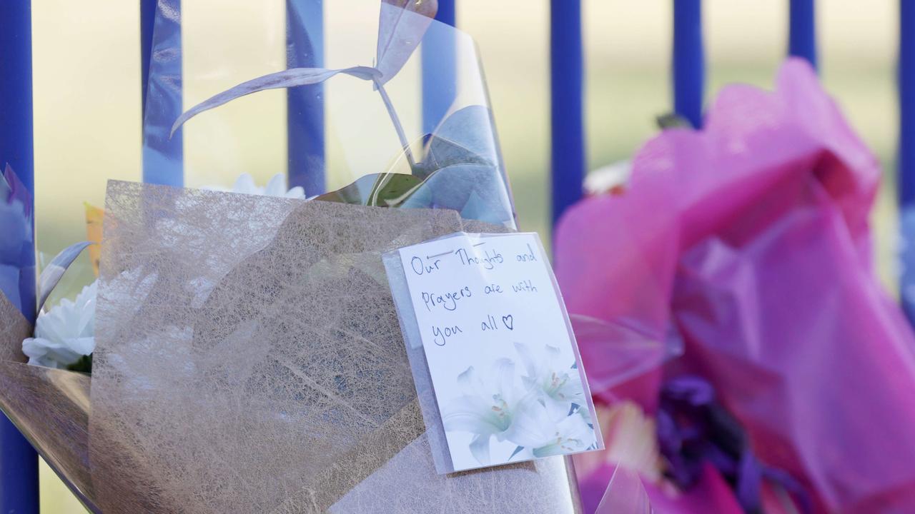 Flowers were laid with a note at Hillcrest Primary School in Devonport. Picture: Grant Viney