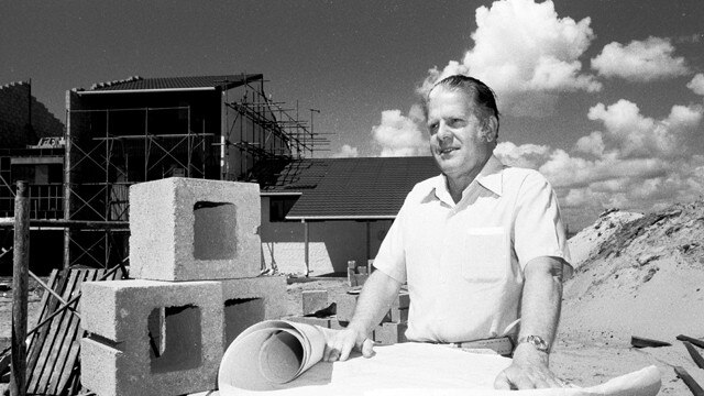 Jock McIlwain with plans at a Gold Coast construction site in the 1970s Picture: A.L. Lambert. Photo supplied by the Gold Coast Local Studies Library.