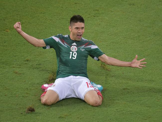 Mexico forward Oribe Peralta celebrates after scoring the only goal during the Group A World Cup match between Mexico and Cameroon.