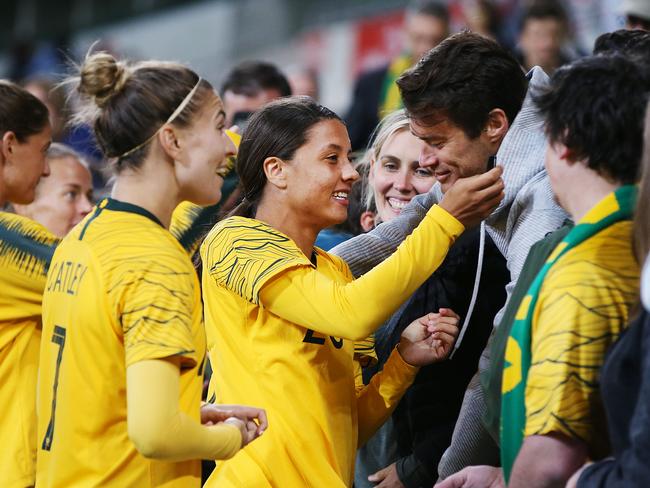 Sam Kerr and fans savour the victory against Argentina.