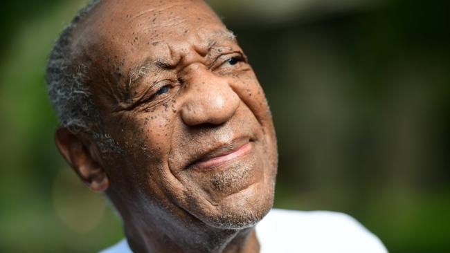 Bill Cosby looks on outside his house after Pennsylvania's highest court overturned his sexual assault conviction and ordered him released from prison immediately, in Elkins Park, Pennsylvania.