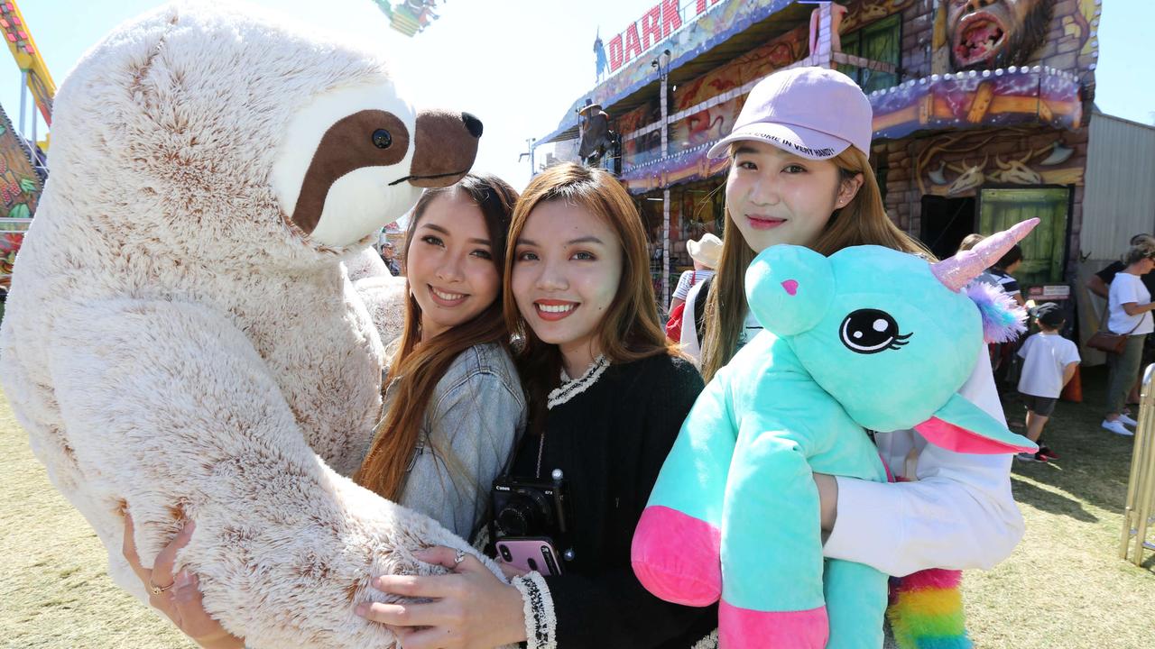 Christine Villahermosa., Sophia Le and Frances Wen get something soft to hug at the Gold Coast Show. Picture: Mike Batterham