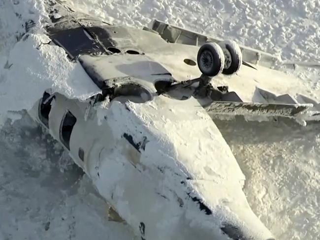 This image taken from video provided by CTV shows an aerial view of the overturned plane at Toronto Pearson Airport, Tuesday, Feb. 18, 2025. (CTV via AP)