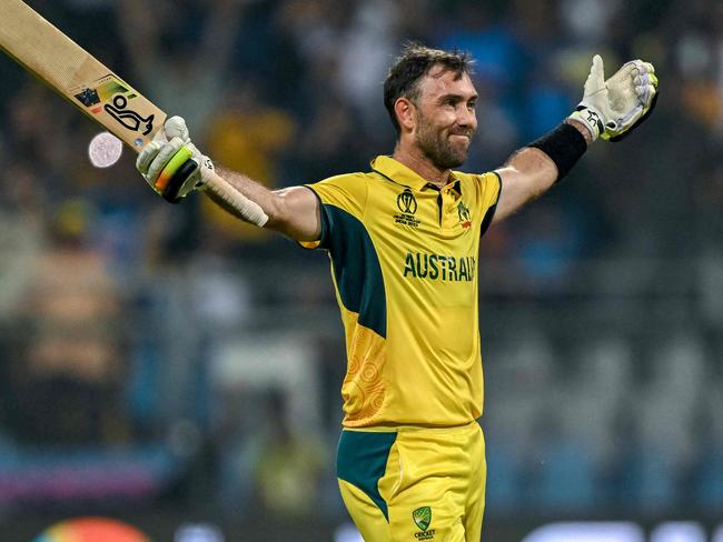 TOPSHOT - Australia's Glenn Maxwell celebrates after winning the 2023 ICC Men's Cricket World Cup one-day international (ODI) match between Australia and Afghanistan at the Wankhede Stadium in Mumbai on November 7, 2023. (Photo by INDRANIL MUKHERJEE / AFP) / -- IMAGE RESTRICTED TO EDITORIAL USE - STRICTLY NO COMMERCIAL USE --